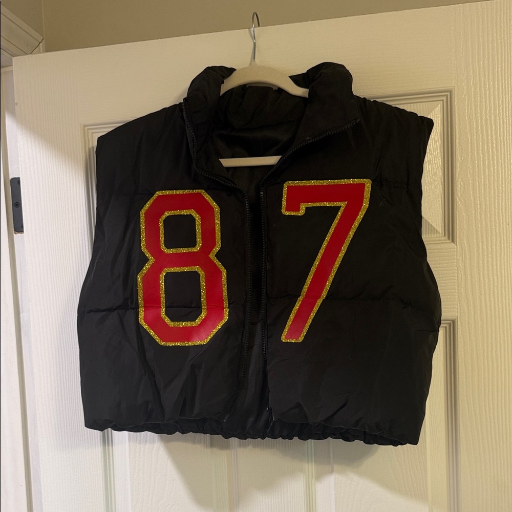 Black Puffer Vest with Red and Gold Numbers